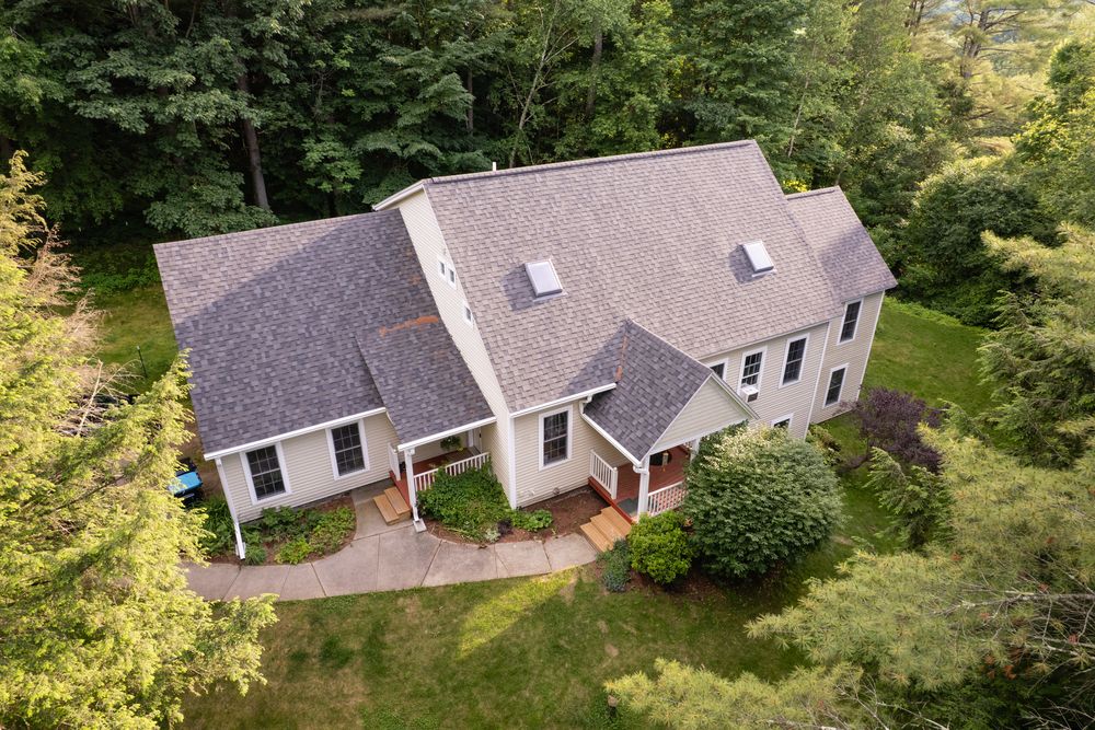 Asphalt shingle roof on a two-story home in Jericho, Vermont
