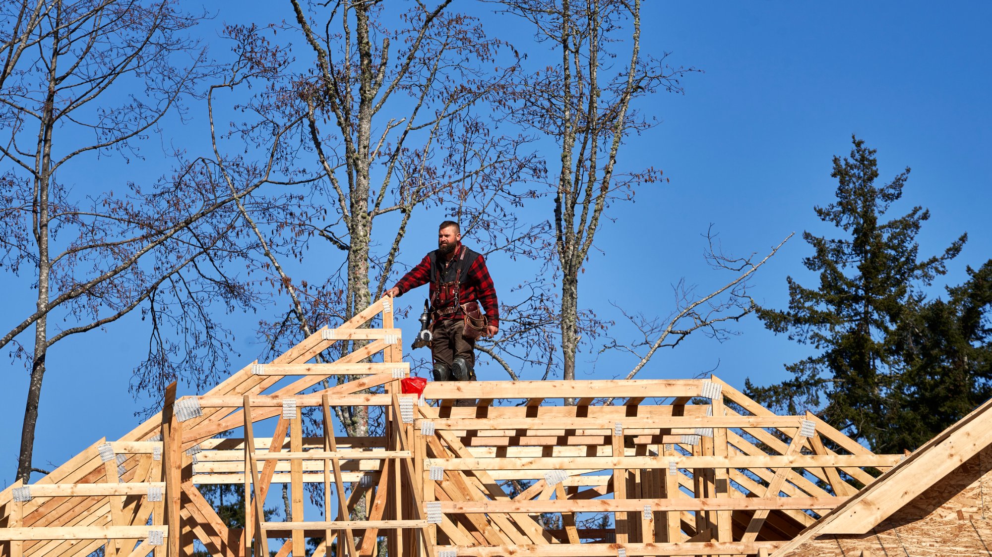 Framing crew on wood roof structure — Vermont construction