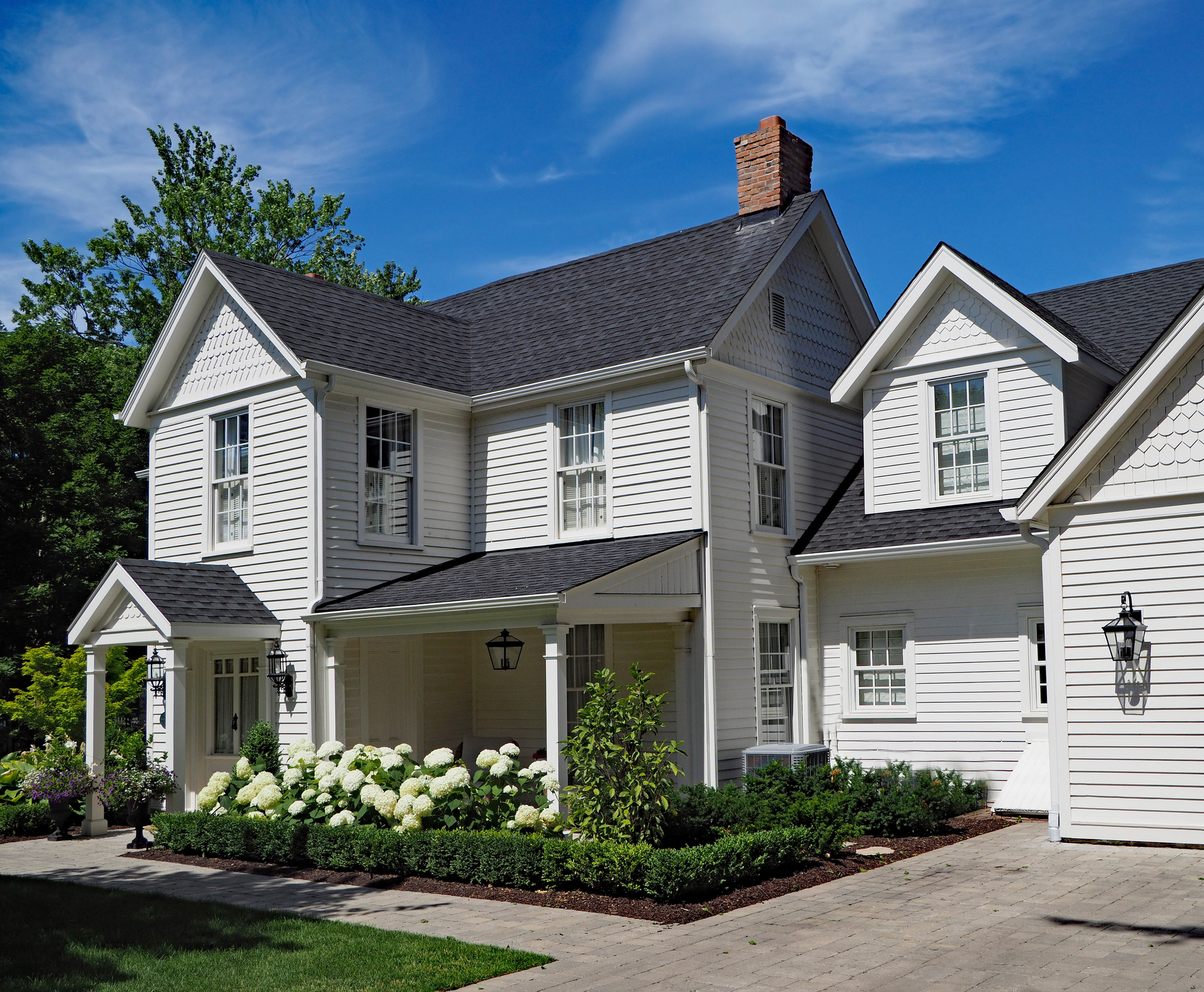 White colonial home with fiber cement siding — Vermont residential