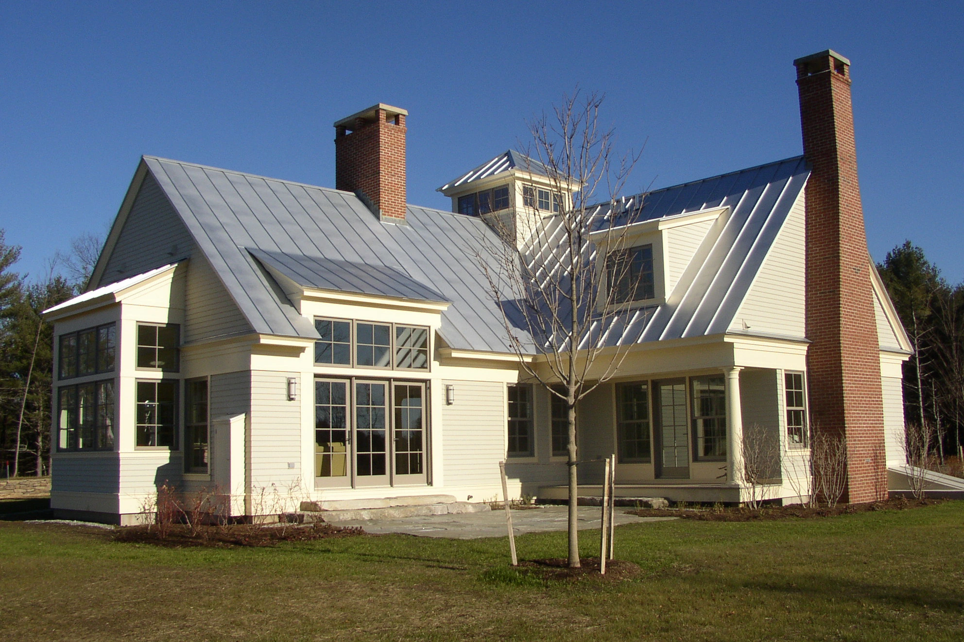 Vermont home with standing seam metal roof — farmhouse style