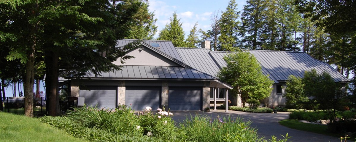 Standing seam metal roof — gray panels on New England home